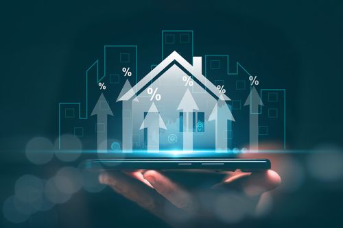 Hologramm eines Hauses auf einer Hand